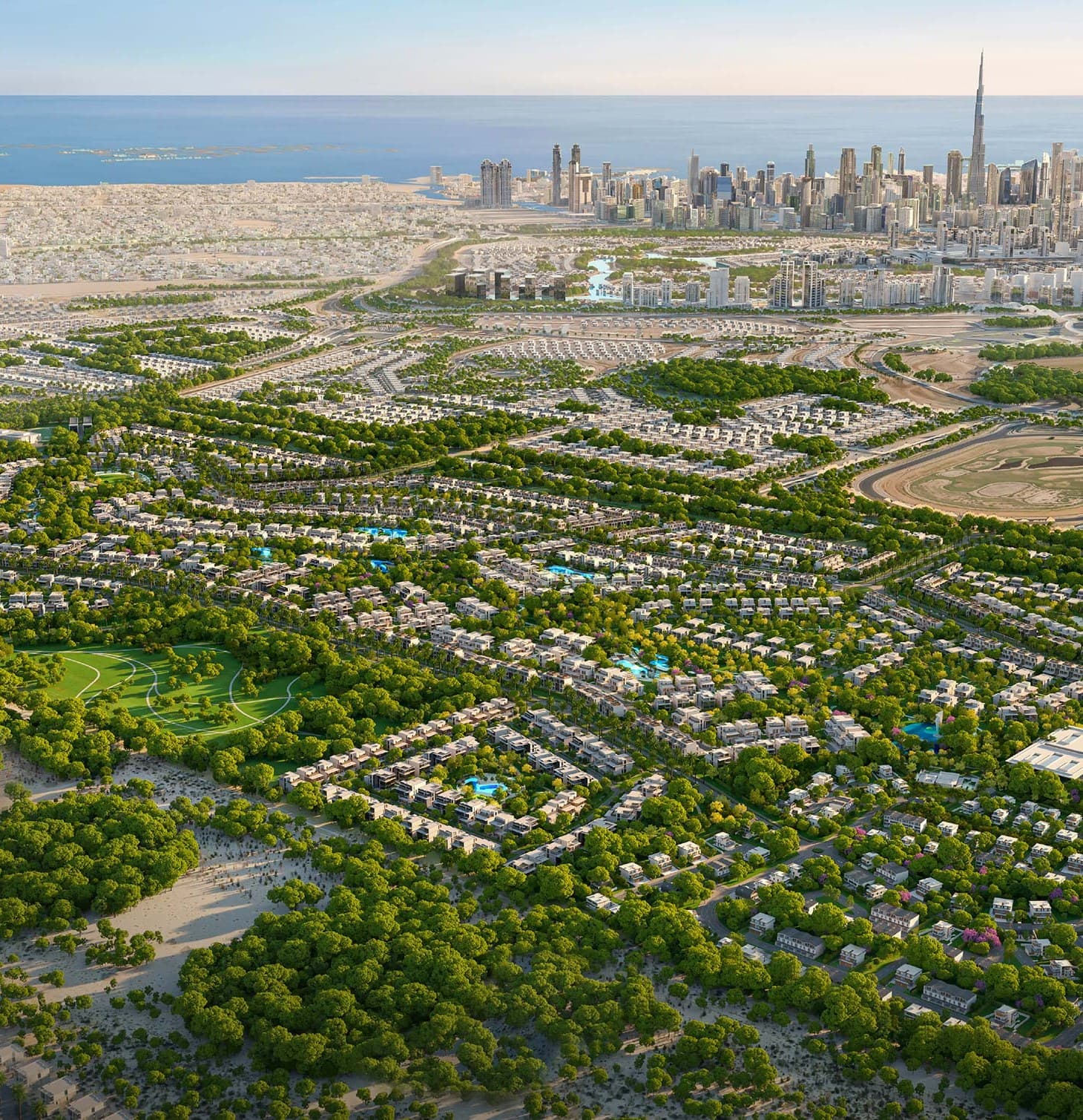Nad Al Sheba Gardens by Meraas — aerial of the green villa community with the Downtown Dubai skyline and the Burj Khalifa on the horizon